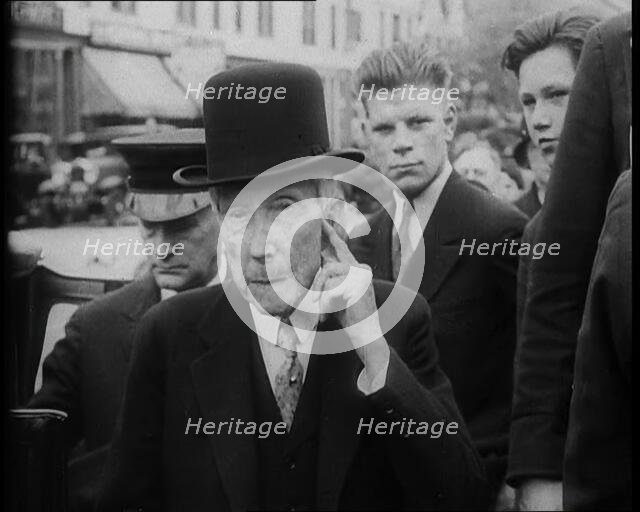 John D. Rockefeller Standing with Other People Next to a Car, 1933. Creator: British Pathe Ltd.