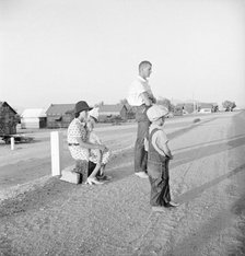 Oklahoma farm family on highway between Blythe and Indio - self-resettlement in California, 1936. Creator: Dorothea Lange.