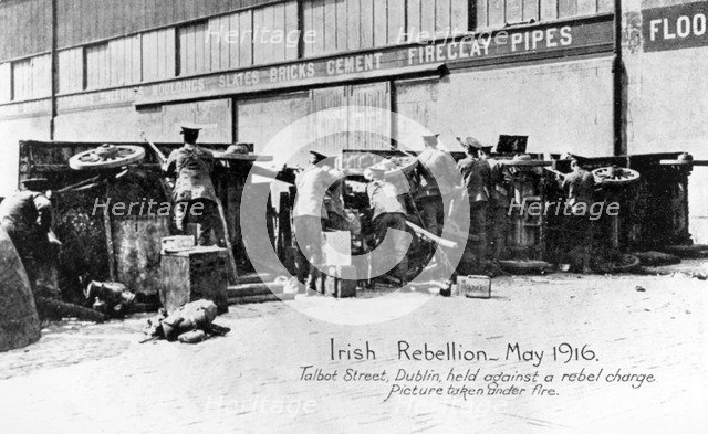 English troops under fire in Talbot Street, Anti-English Irish uprising, Dublin, May 1916. Artist: Unknown