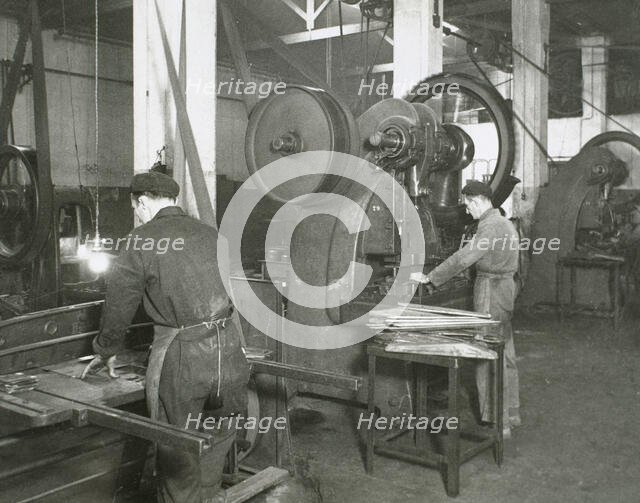Production line of a company who manufacture motorcycle components, Barcelona, Spain, 1945.  Creator: Unknown.