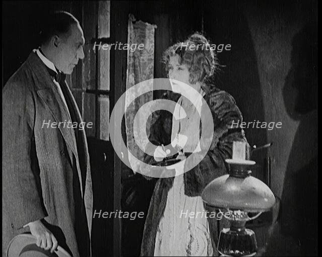 Scene from the Short Silent Feature Film 'Poppies of Flanders'. A Female Actor and a Male..., 1920s. Creator: British Pathe Ltd.