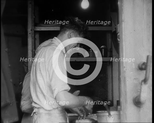 British Cooks Preparing Food for Soldiers Aboard a Ship Evacuating Dunkirk, 1940. Creator: British Pathe Ltd.