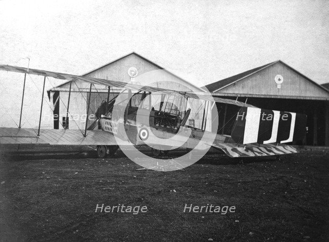 England. Caproni 600 biplane H 1918 next to the hangars.