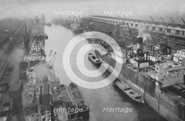 'A Great Dockland of the North, Thirty-Four Miles from Sea and Yet a Port', c1935. Artist: Manchester Ship Canal Company.