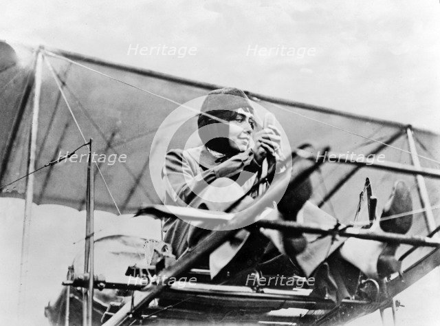 Hélène Dutrieu at the controls of her plane, c.1911.