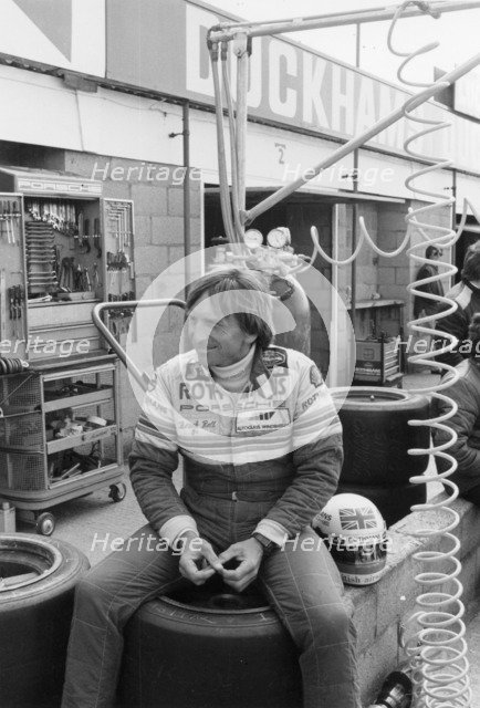 Derek Bell in the pits. Artist: Unknown