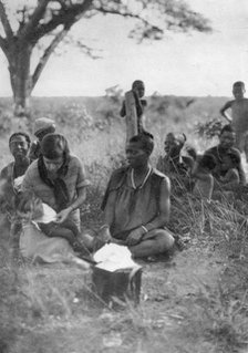 Stella Court Treatt tending a sick baby, Bulawayo to Dett, Southern Rhodesia, c1924-c1925 (1927). Artist: Thomas A Glover