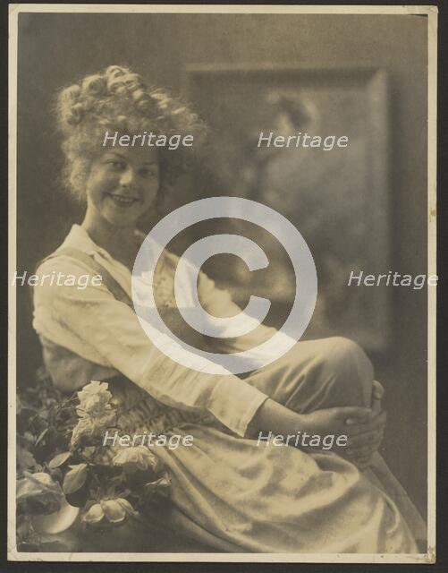 Portrait of a Woman in Pinafore with Flowers, 1907-1943. Creator: Louis Fleckenstein.