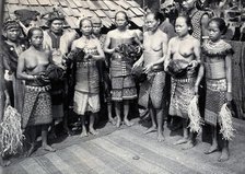 Sarawak: Sea Dayak men at a head feast, c1900. Creator: Unknown.