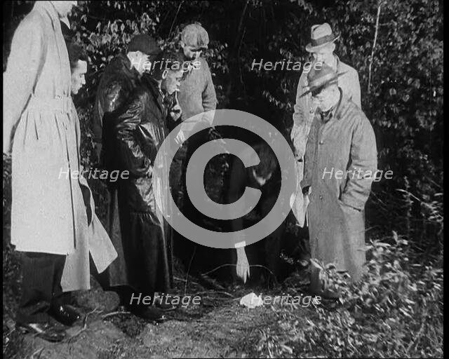 American Police Officers Searching the Area Outside American Aviator Charles Augustus..., 1930s. Creator: British Pathe Ltd.