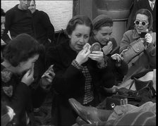 Dutch Refugees Fleeing Aboard Ships in the Netherlands. Women Are Applying Makeup, 1940. Creator: British Pathe Ltd.