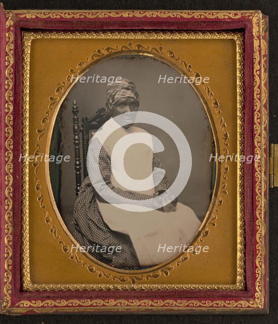 Unidentified African American woman in headscarf and apron, between 1850 and 1870. Creator: Unknown.