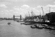 Tower Bridge with shipping in the Pool of London and at Hay's Wharf, Southwark, London, c1945-c1965. Artist: SW Rawlings
