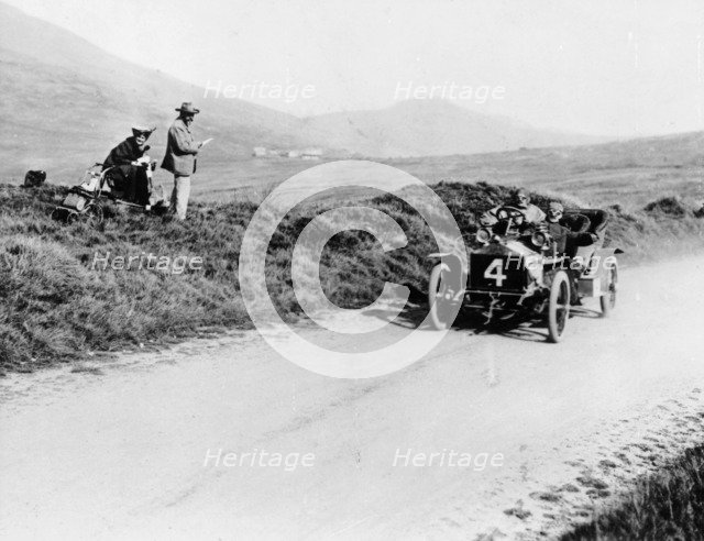 Charles Rolls on the way to winning the Isle of Man TT race in a 20 hp Rolls-Royce, 1906. Artist: Unknown