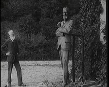 Playwright George Bernard Shaw Standing Next To a Statue of Himself, 1920s. Creator: British Pathe Ltd.