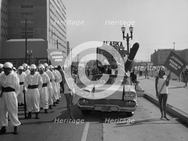 Models and a Cadillac on a parade, USA, (c1959?). Artist: Unknown