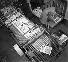 Stacking finished brochures at a printers, Mexborough, South Yorkshire, 1959. Artist: Michael Walters