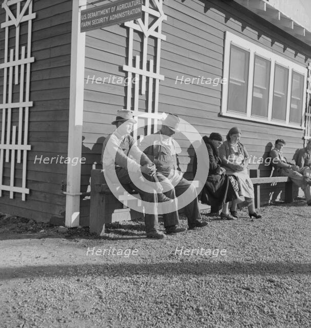 Lineup outside of Farm Security Administration grant office early in the morning, Tulare, CA, 1938. Creator: Dorothea Lange.
