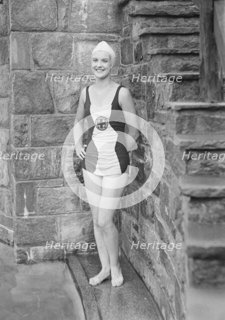 Ford, Elsie, Miss, standing outdoors in a bathing suit, 1932 July. Creator: Arnold Genthe.