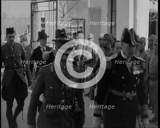 British Military Leaders Walking Through a Gate of Official Building in Shanghai to..., 1937. Creator: British Pathe Ltd.