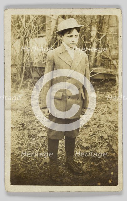 Photographic postcard of a boy wearing a double-breasted jacket and breeches, early 20th century. Creator: Unknown.