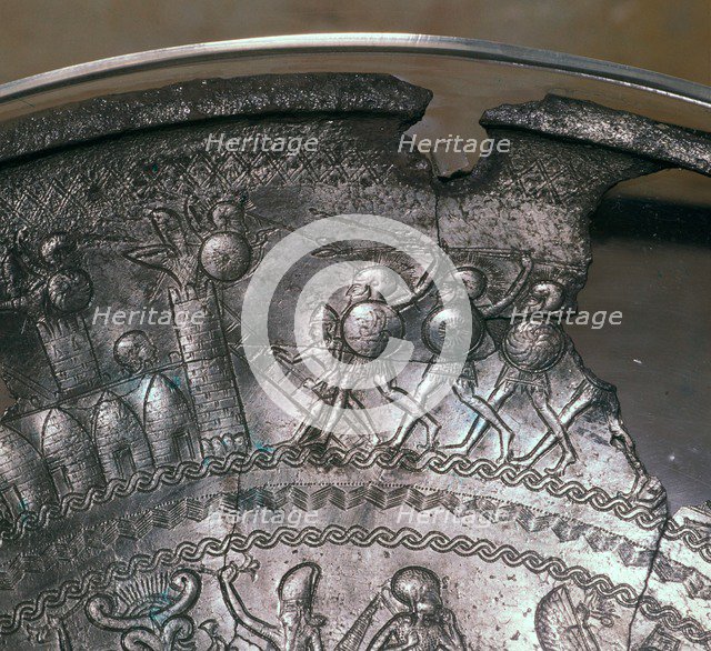 Detail of a Phoenician silver bowl showing soldiers attacking a city, 7th century BC. Artist: Unknown