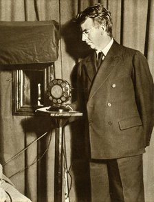 John Logie Baird watching the first play to be televised, 14 July 1930, (1935). Creator: Unknown.
