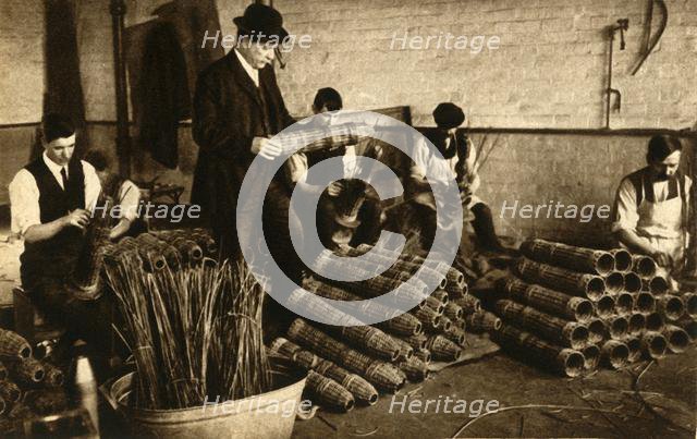 Weaving baskets for artillery shells, Nottingham, First World War, 1914-1918, (1933).  Creator: Unknown.