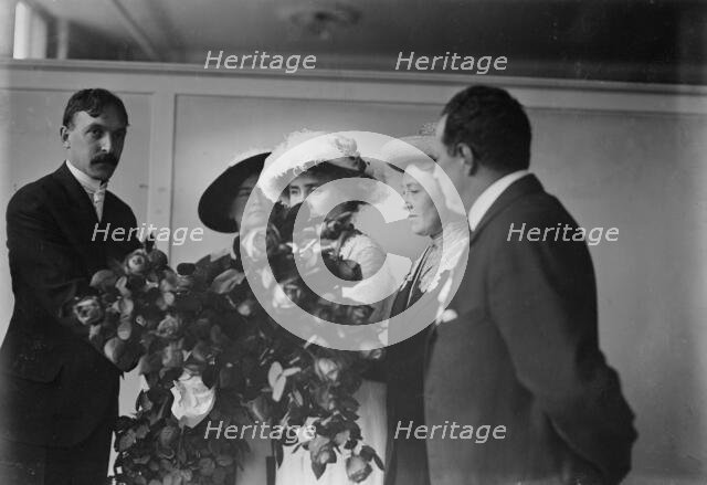 Irving Bertman presents flowers to Helen Keller, Flower Show, 1913. Creator: Bain News Service.