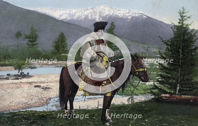 Altai Man in National Costume (Hat: Kuaraan Boruk, Sheepskin Coat: Ton, with a..., 1911-1913. Creator: Sergei Ivanovich Borisov.