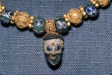 Phoenician glass head on Etruscan Necklace, c7th century BC. Artist: Unknown.