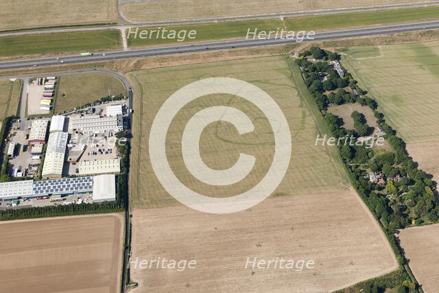 Enclosure and ring ditch crop marks near Minster, Kent, 2015. Creator: Historic England.