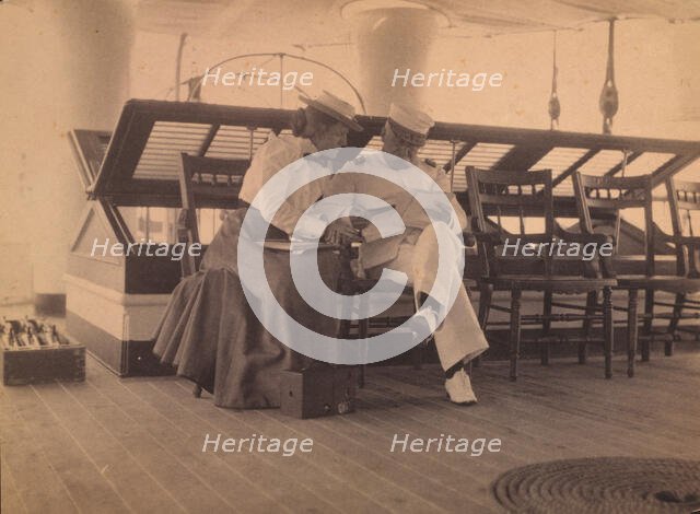 Frances B. Johnston and Admiral Dewey on the deck of the U.S.S. Olympia, 1899. Creator: Unknown.