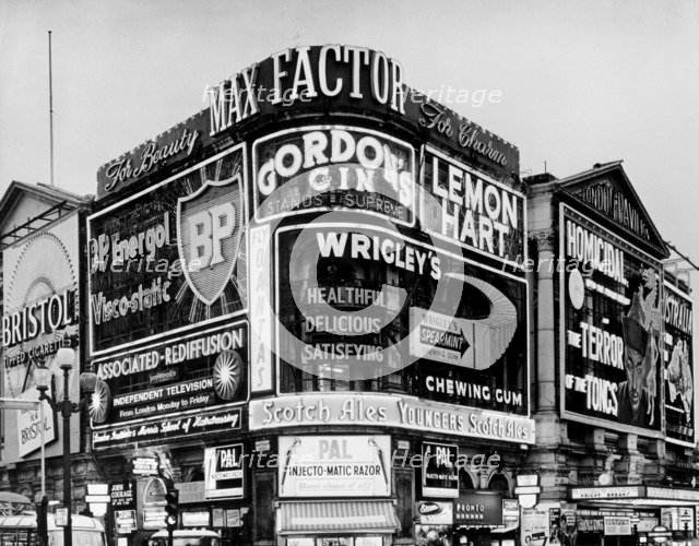 The corner of Piccadilly Circus, Westminster, London, c1961. Artist: Unknown