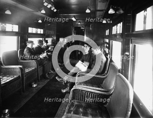 Buffet library car on a deluxe overland limited train, between 1910 and 1920. Creator: Unknown.