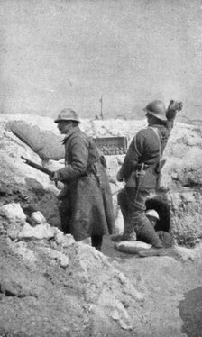 Life in the trenches in Champagne; The outpost re-arms immediately..., 1917. Creator: Unknown.