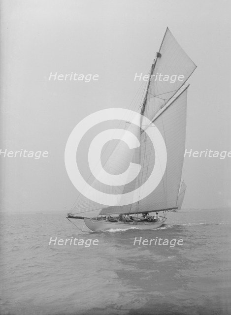 The 15 Metre cutter 'Ma'oona' sailing close-hauled, 1914. Creator: Kirk & Sons of Cowes.
