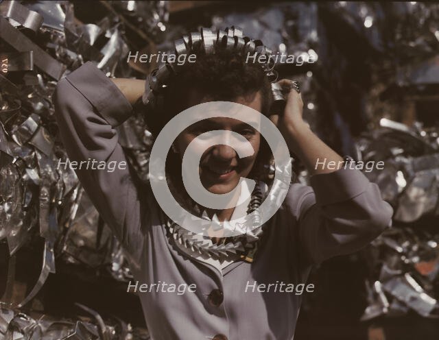 Annette del Sur publicizing salvage campaign...Douglas Aircraft Company, Long Beach, Calif., 1942. Creator: Alfred T Palmer.