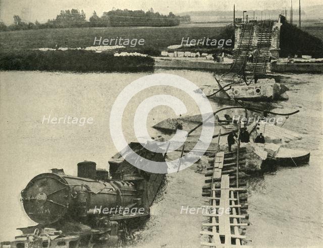 Bombed bridge and derailed train, northern France, First World War, 1914, (c1920). Creator: Unknown.