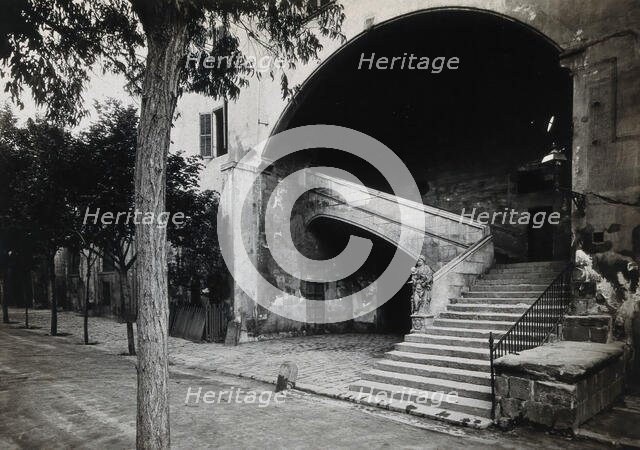 Hospital de la Santa Cruz, Barcelona: a staircase leading up to the men's department... Creator: Unknown.