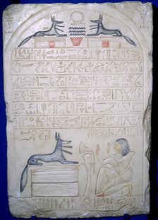 Egyptian elief stele of a man adoring Anubis. Artist: Unknown