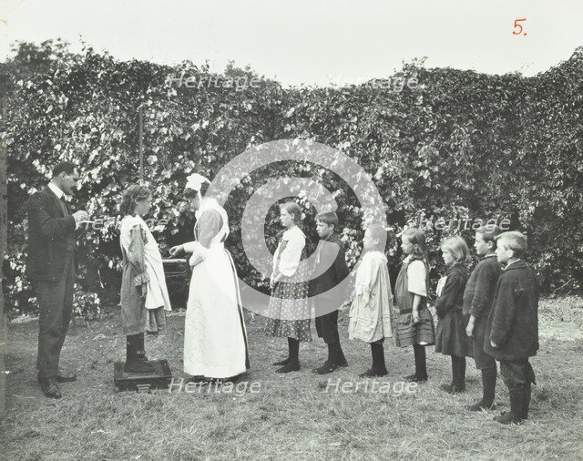 Children being weighed in the garden, Montpelier House Open Air School, London, 1908. Artist: Unknown.