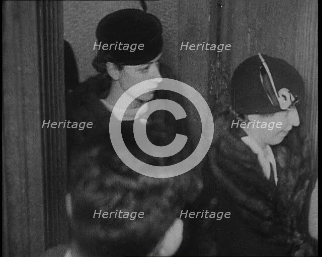 Bessie Mowat Goway AKA Betty Gow, Nurse of the Lindbergh Family Entering a Courtroom, 1930s. Creator: British Pathe Ltd.