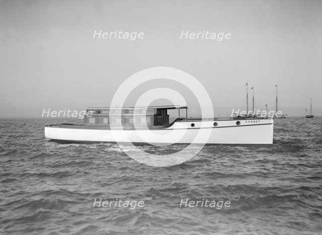 The motor launch 'Cygnet' under way, 1912. Creator: Kirk & Sons of Cowes.