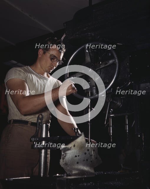 An employee in the drill-press section of North American's huge machine..., Inglewood, Calif. , 1942 Creator: Alfred T Palmer.