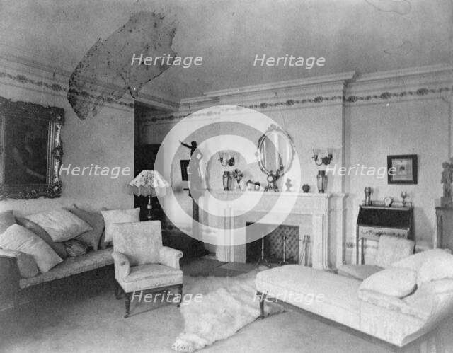 Bedroom with fireplace, padded chaise longue, sofa, male nude..., Greenwich, Connecticut, 1908. Creator: Frances Benjamin Johnston.