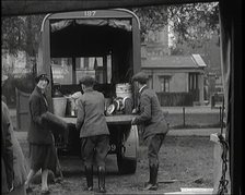 Civilians Dismantling an Emergency Food Distribution Centre and Loading Products Into a..., 1926. Creator: British Pathe Ltd.