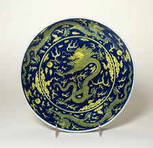 Blue-Ground Yellow-Enameled 'Dragon' Dish, Qing dynasty, Qianlong reign (1736-1795). Creator: Unknown.