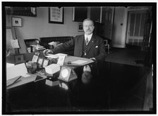 John Skelton Williams at desk, between 1913 and 1918. Creator: Harris & Ewing.