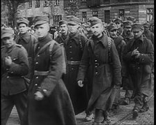 Male Polish Soldiers Walking Along a Warsaw Street, 1939. Creator: British Pathe Ltd.